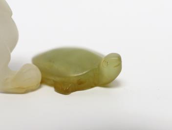 A 19th century Chinese jade model of a lion-dog, 9cm, together with a hardstone ‘tortoise’ pendant